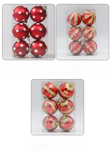 Detailed view of hand-painted 6cm Christmas balls in assorted festive red and gold styles