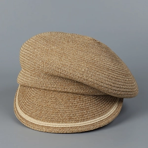 Detail of hand-woven straw horseman hat with striped texture in dark oatmeal color