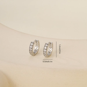Silver zircon hoop earrings with heart cutouts and dimensions 1.2cm x 0.3cm
