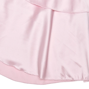 Detailed close-up of pink satin fabric featuring elegant ruffles and fine stitching