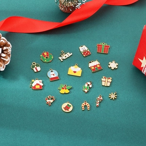 Detailed overhead view of festive Christmas charms including snowmen and enamel alloy pendants