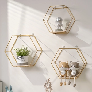 Golden hexagonal floating wall shelf set with wooden base for minimalist home decoration