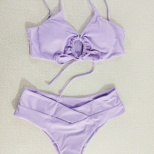 Lavender purple halter bikini set with ring detail and V-shaped crossover waist bottoms