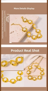 Detail of gold-plated stainless steel chain bracelet featuring natural pearls and lobster clasp