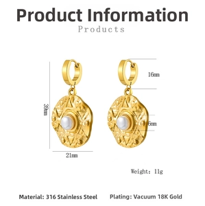 Detailed view of irregular 18K gold plated stainless steel earring with a white pearl inlay