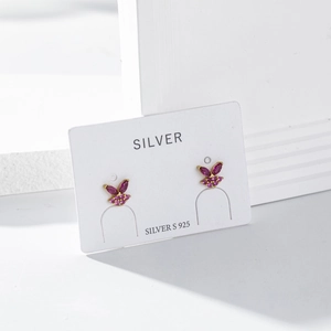 Close-up of S925 sterling silver rabbit stud earring with pink purple gemstone and gold finish