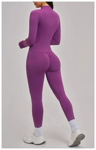 Detail view of purple yoga jacket featuring seamless high neck and slim fit athletic tailoring