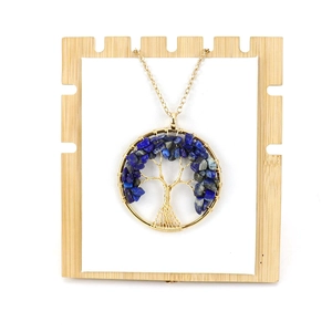 Handmade gold wire-wrapped tree of life necklace with blue crystal stone pendant