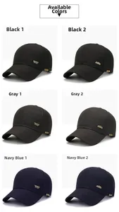 Detail of men's baseball caps in black, grey, and navy with metal logo decorations