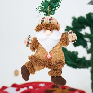 Detailed view of burlap Santa hanging ornament with plush details and wood button on pine
