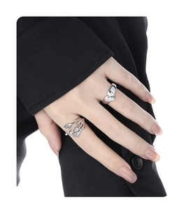 Close-up of S925 silver heart gemstone ring and branch design ring on model finger