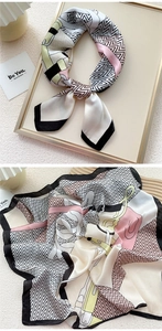 Detailed view of elegant silk scarf with abstract geometric patterns and silky texture