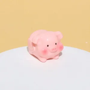 Detail view of pink resin pig figurine with 23x32mm dimensions and 13g weight
