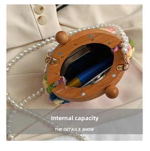 Detail show of colorful crochet shell bag with wooden frame and pearl chain interior space