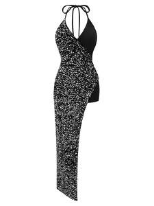 Detail of sequined asymmetric hem and halter neckline on a sleek black evening gown