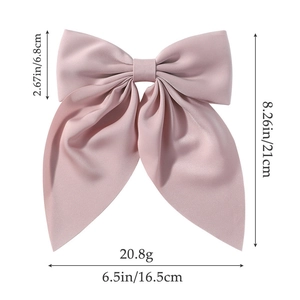 Pink oversized fabric bow hair clip with detailed dimensions and weight specifications
