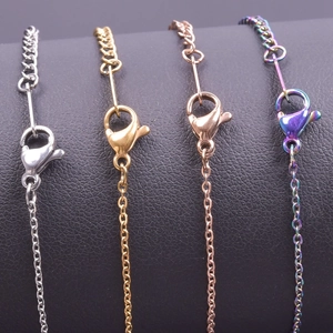 Detail view of colorful stainless steel cross chains with secure lobster clasps