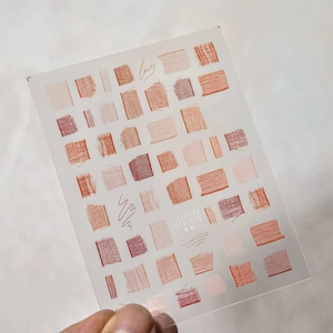 Macro detail of MS 705 nail art stickers with vintage lace and plaid textures