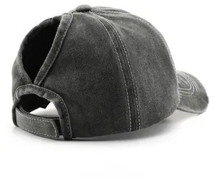 Detail view of washed cotton baseball cap with ponytail hole and adjustable velcro strap