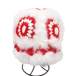 Cute red plush earmuff hat with white faux fur trim and knitted flower patterns