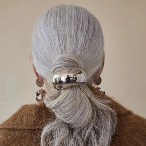 Polished silver stainless steel ponytail cuff hair ring accessory for a minimalist look