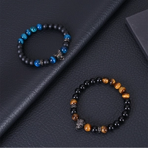 Macro shot of 8mm blue tiger eye stone bracelets with micro-paved zircon wolf head pendants