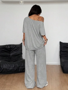 Detail view of the back of grey off-shoulder loungewear set with wide-leg pants