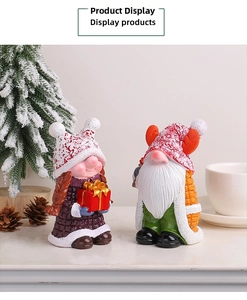 Detailed view of resin Christmas gnomes with matte texture and holiday gift box decor