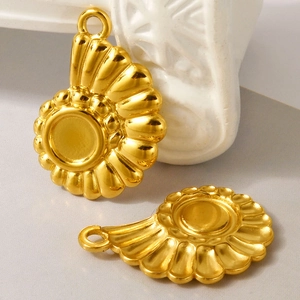 Macro detail of 18K gold plated seashell charms for DIY necklace and bracelet making