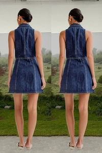 Detail of back seams and A-line silhouette on sleeveless dark blue denim dress