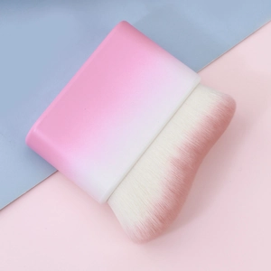 Detail of soft high-density gradient bristles on a wave-shaped petal foundation brush