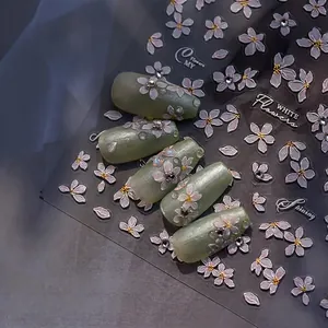 3D white pear flower nail stickers with tassels and rhinestones on green nails