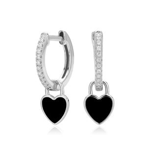 Macro shot of 925 silver hoop earrings with black enamel heart charms and zircon stones