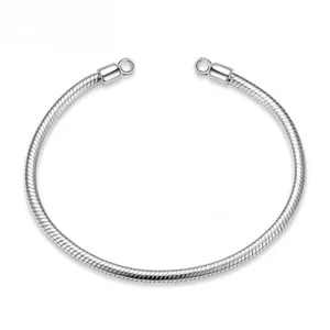 Macro detail of silver S925 snake chain bracelet base with secure DIY loop connectors