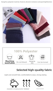 Detail of multi-color cotton linen scarves showing 100% polyester fabric and fringe tassels