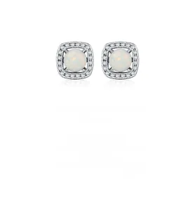 Macro shot of silver stud earring featuring round opal stone with halo diamond setting
