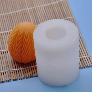 Textured egg silicone mold for DIY Easter candles with intricate herringbone relief pattern