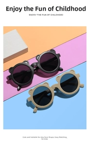 Detail of cute bear-ear sunglasses for kids in matte black and beige frames