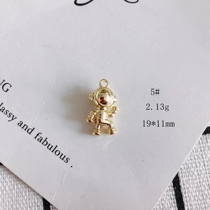 Detail view of a gold-plated astronaut pendant with size 19x11mm and 2.13g weight specs