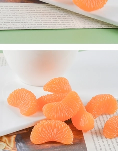 Macro detail of realistic PVC orange segment keychain with lifelike fruit pulp textures