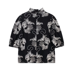 Black standing collar short sleeve top with white floral embroidery and puff sleeves