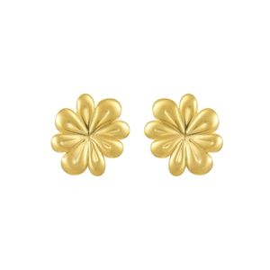 Close-up of golden flower stud earrings with detailed brushed metallic petal texture