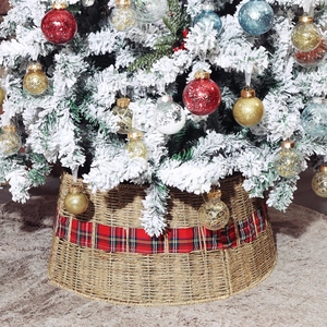 Foldable natural seagrass Christmas tree collar with a festive red plaid fabric ribbon