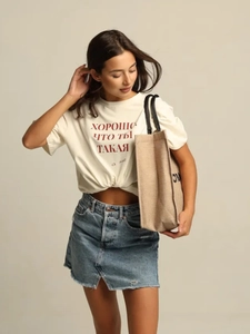 White 100% cotton T-shirt with Russian text paired with a blue denim skirt and tote bag