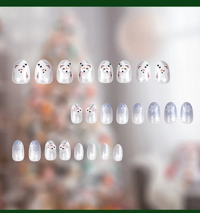 Detailed view of 24pcs Christmas fake nails featuring snowmen and snowflake designs
