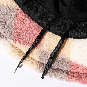 Colorful teddy fleece bucket hat featuring patchwork faux fur and adjustable inner drawstring
