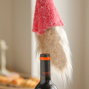 Christmas gnome wine bottle cover with red knit hat and plush white beard festive decor