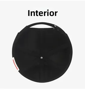 Inside view of black docker hat showing stitched fabric panels and brand label