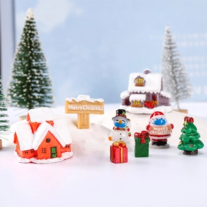 Miniature Christmas set with Santa Claus, snowman, and tree for holiday micro landscapes