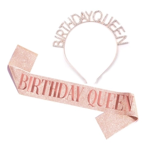 Close-up of rose gold Birthday Queen tiara and pink glitter sash for birthday parties